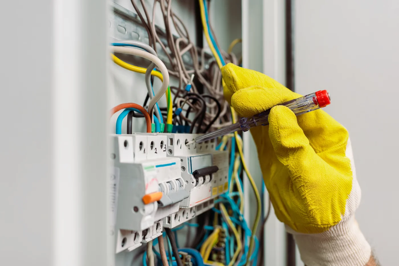 A domestic electrician in Leeds working on the electrical system of a residence.