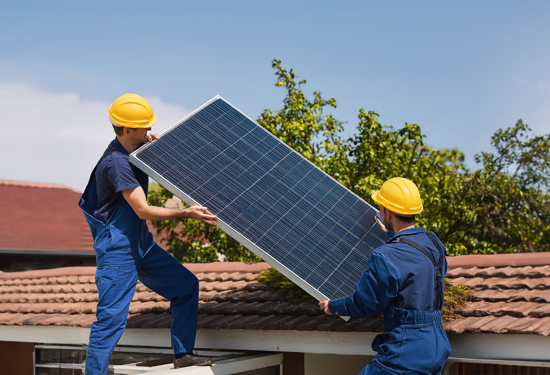 2 electricians installing solar panels after the house owner checked the cost.